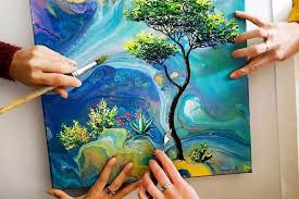 Hands creating colorful community artwork